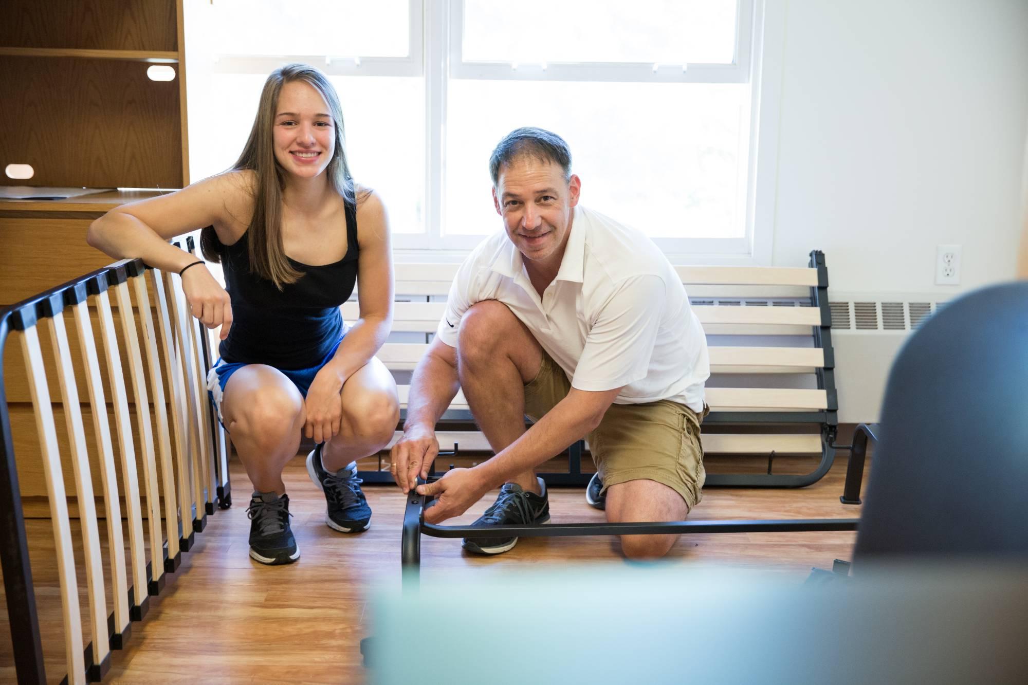 parent and student in dorm room